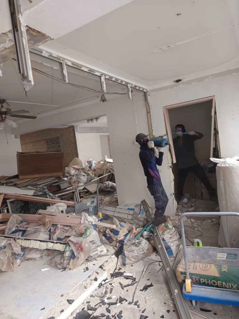Hacking and demolition contractor working in Singapore office